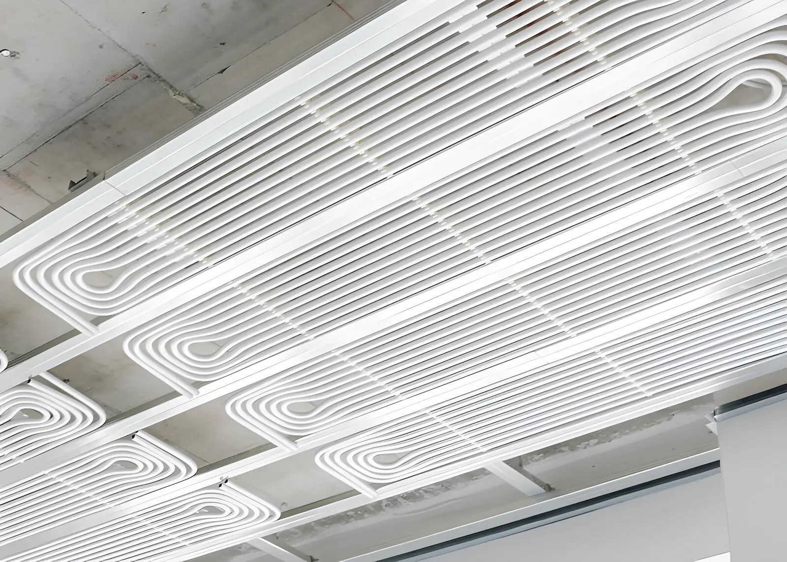 Ceiling cooling panels installed in an open-plan office for silent cooling