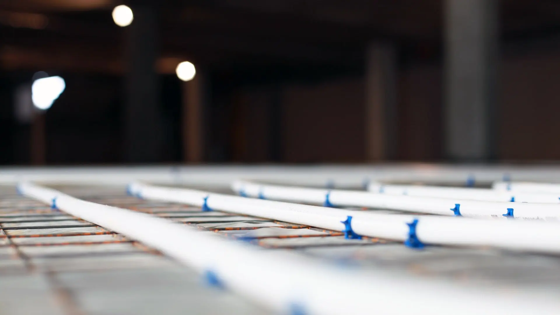 Fluxbite underfloor heating pipes installation on grid system in a commercial project
